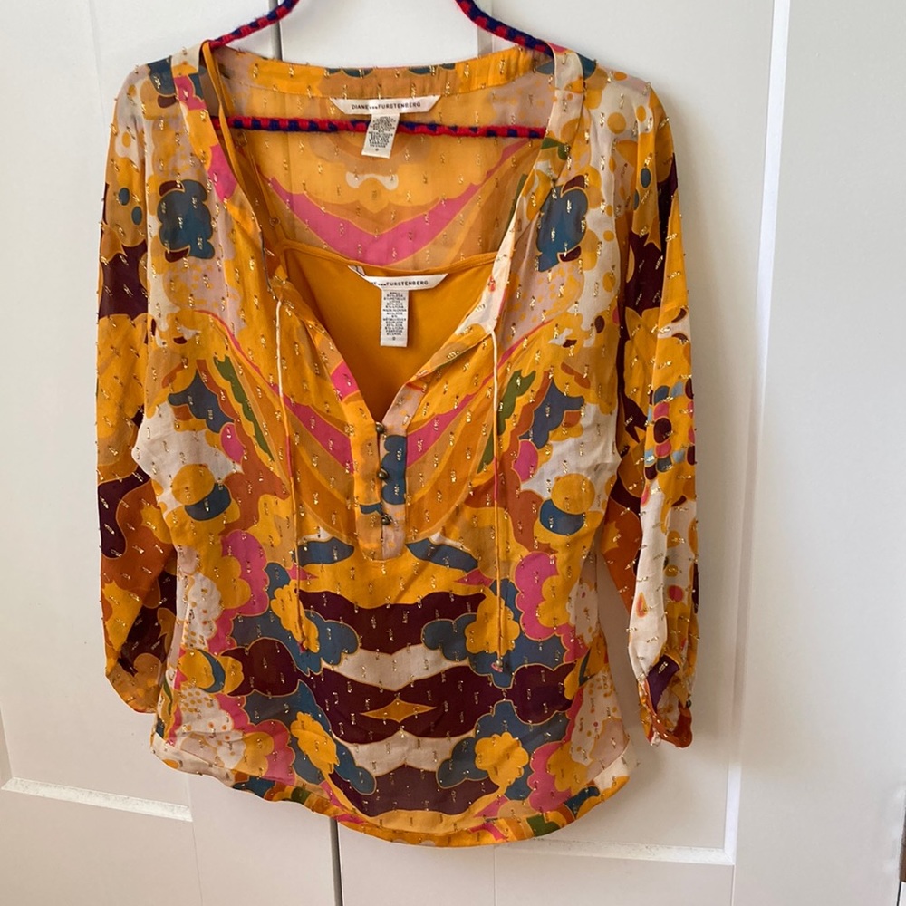 Fun, bright, chic multi-colored silk DVF blouse.